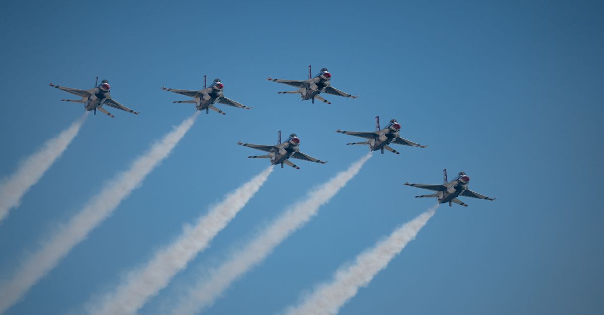 A stunning airshow featuring fighter jets in formation over Huntington Beach, CA.